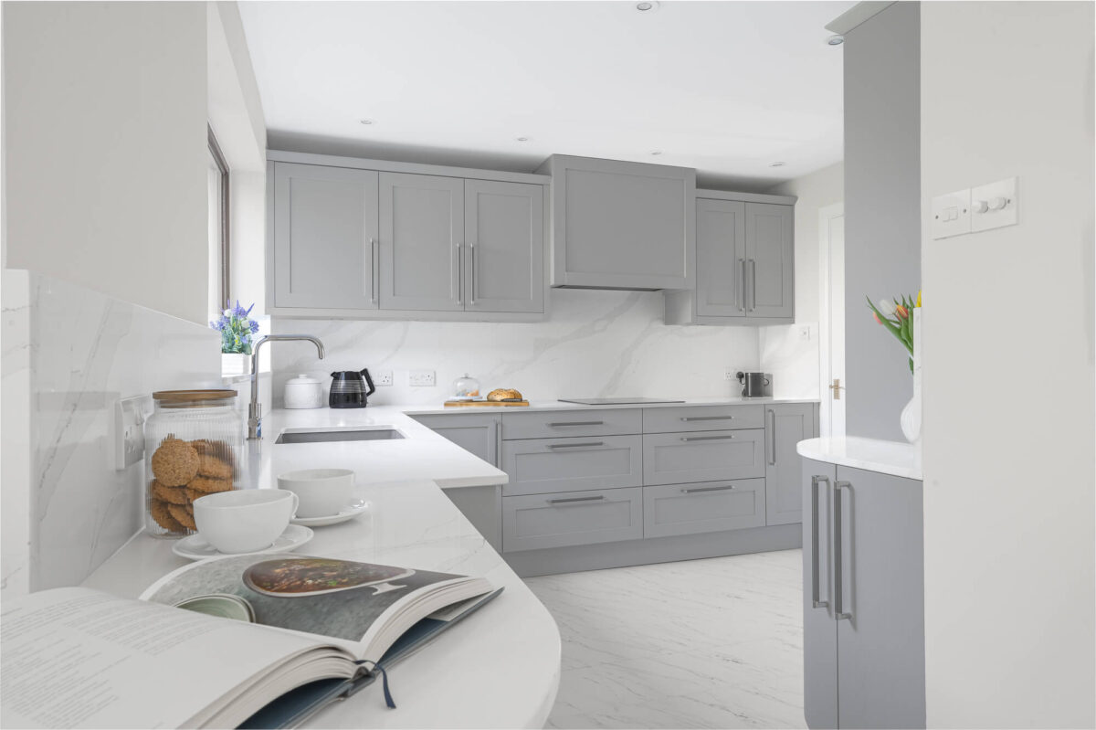 Callerton Grey Classic Kitchen & Dining Space Curved Kitchen in Callerton Grey with quartz worktops